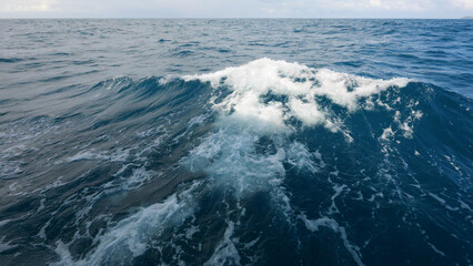 Fototapeta premium Side view from boat in Indian ocean sailing between Seychelles islands in daytime with big waves