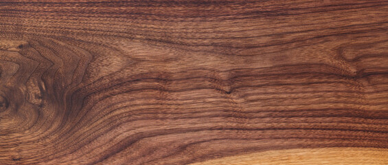 Texture of black walnut board with oil finish