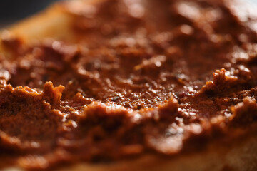 Closeup ciabatta with red pesto sauce
