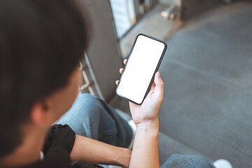 Close up - Hands of man using mobile phone blank white screen mockup, Background empty space for advertise, technology