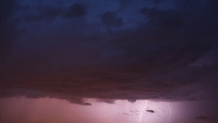 Evening sky storm clouds with lightning