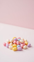 Obraz premium A bunch of colorful, dye-free Easter eggs on a white surface against a pink background.