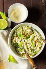 Waldorf salad with celery, apple and nuts, dressed with mayonnaise.
