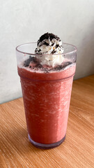 Red velvet frappe with sprinkled choco topping, milk and ice blend together with whip cream and...