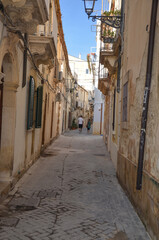 a narrow and charming street in Syracuse, Sicily