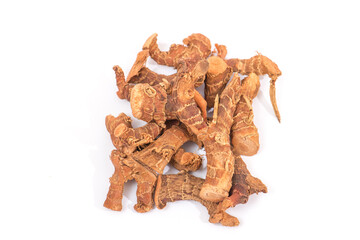 Dried galangal root isolated on white background, aromatic spice and herbal medicine concept
