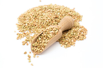 Green buckwheat isolated on white background, organic grain and healthy eating concept