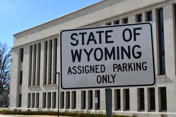 Fototapeta premium State of Wyoming assigned parking only sign. Local government building parking lot.