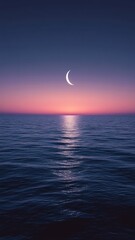 Crescent moon illuminating tranquil ocean at twilight