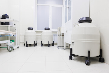 The clean, organized clinical lab has cryogenic storage tanks for preserving biological samples safely