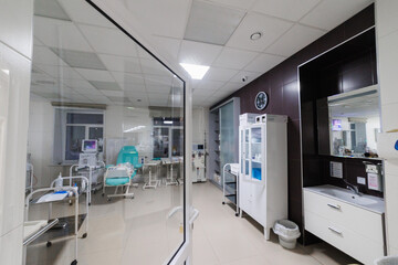 A modern hospital room with advanced medical technology and treatment areas for optimal patient...