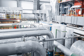 Steel pipelines, valves and ladders modern gas power plant, industrial factory