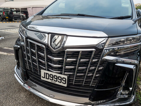 Hong Kong. China- 02.14.2025. The front of a TOYOTA Alphard Executive Lounge luxury MPV, showing the brand badge and personalised number plate.