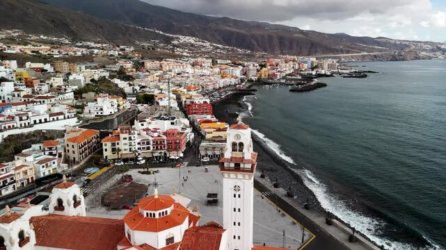 Explore the stunning aerial view of Candelaria city in Tenerife, Canary Islands, showcasing its coastal charm and vibrant architecture