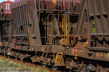 blue road sign with right arrow on green grass.