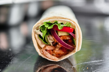 Delicious Chicken Shawarma Wrap with Fresh Vegetables and Sauce