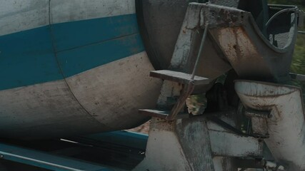 Concrete mixer truck unloading at construction site