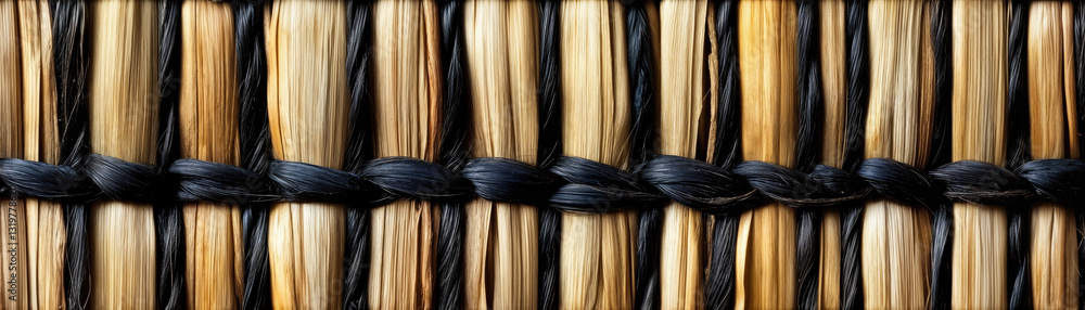 Aufkleber close-up of woven straw mat texture with black string accents in horizontal pattern