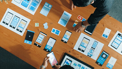 Top view of software developer working on Ux Ui design while team working together to brainstorm...