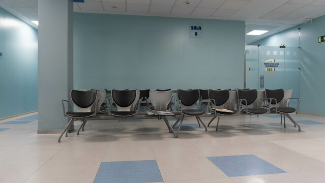 Waiting room with no one in a health center with corridors deserted of people