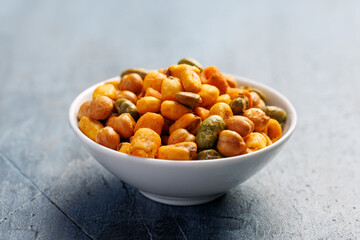 Sweet chilli Crunch protein packed mix of baked corn pieces, edamame beans, chickpeas and corn hoops. Healthy snack concept