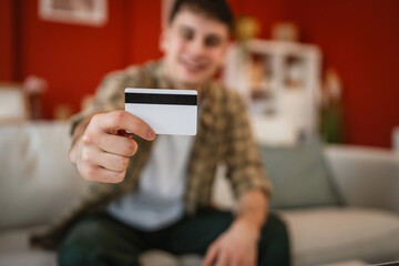 close up on man hands hold credit card ready for online shopping