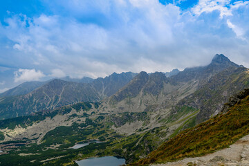 Naklejka premium Scenic Summer View of Tatra Mountains, Clouds in Blue Sky, Green Hills and Valleys, Beautiful Nature Landscape, Zakopane, Poland