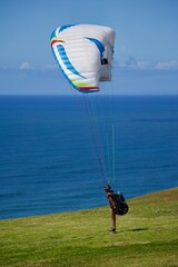 paragliding in the blue sky