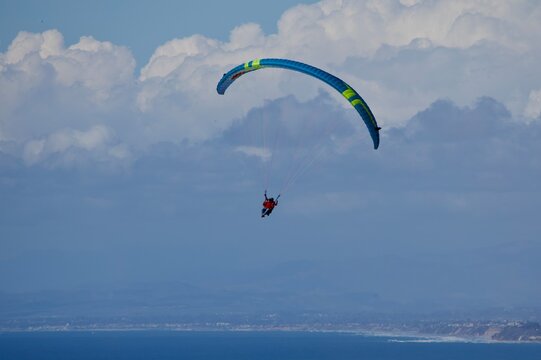 paragliding in the blue sky