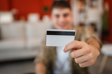 close up on man hands hold credit card ready for online shopping