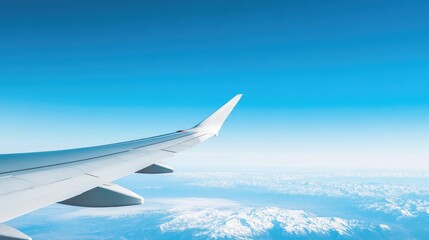 Fototapeta premium Close-up of airplane wing with contrails