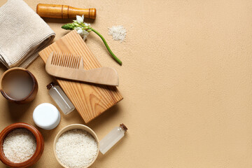 Composition with natural rice water, grains and bath supplies on color background