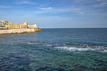 Fototapeta premium View of the Ionian Sea and the buildings of Syracuse