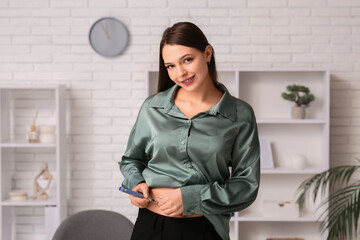 Diabetic woman giving herself insulin injection in office