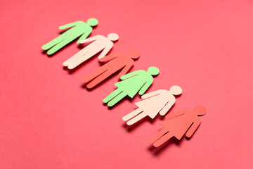 Paper human figures on red background