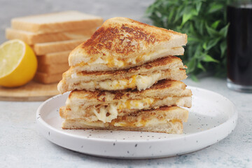 Grilled cheese sandwiches served for eating