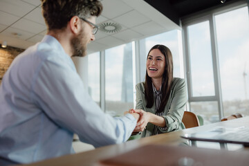 Fototapeta premium Business Professional Handshake During a Productive Meeting in Office Environment