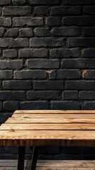 A warm brown wooden table stands empty against a striking black brick wall, offering a perfect setting for gatherings, creative projects, or reflective moments in a cozy environment