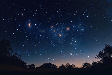 Naklejka premium Starry night sky over a peaceful landscape at twilight with numerous bright stars visible