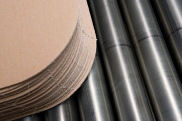 Cardboard industry. Producing cardboard in a factory. Stacked cardboard layers. Paper industry. Stacks