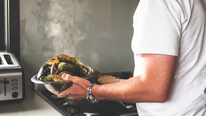 Human hands holding two green lip mussels seafood new zealand fresh