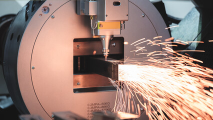 Close up scene the fiber laser cutting machine cutting  machine cut the stainless steel tube. The...