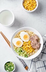 Ramen noodles with pollock liver, corn and scallions in a bowl
