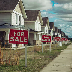 real estate for sale signs many houses available market glut or unstable volatility concept illustration