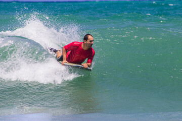 young man surfing