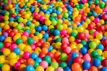 Many colorful plastic balls from a ball pool.