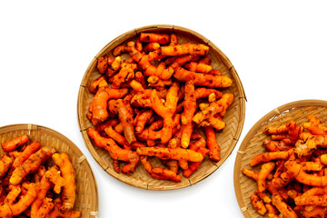 Turmeric roots on white background.