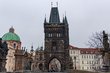 Fototapeta premium Lesser Town Bridge Tower rising above Charles Bridge in Prague
