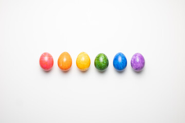 Colorful easter eggs in a line on a white background lgbt