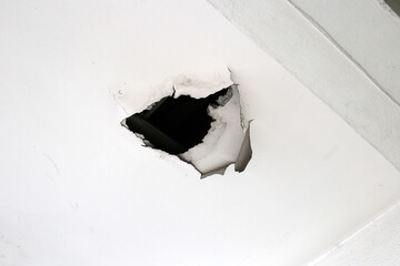 Damaged ceiling with a large hole